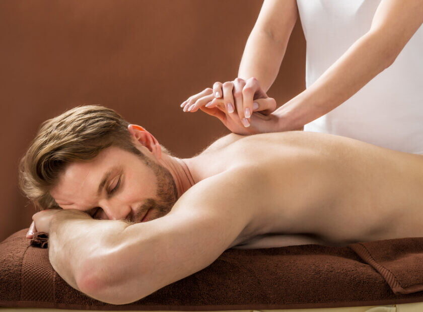 Portrait,Of,A,Young,Man,Receiving,Back,Massage,At,A